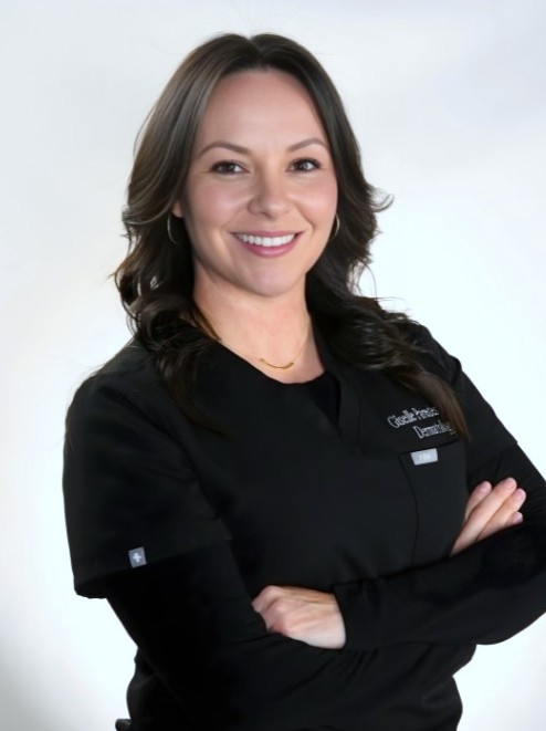 Portrait of Giselle Paredes, MMSc, PA-C, in black scrubs