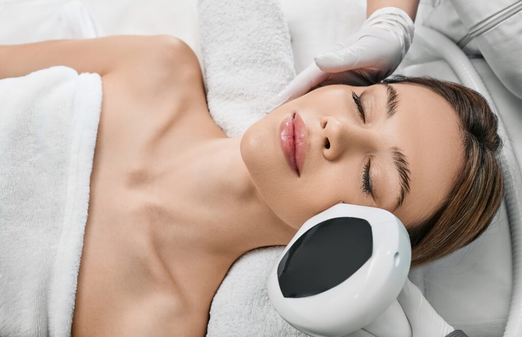 Woman relaxed receiving IPL photofacial treatment in Jacksonville, FL