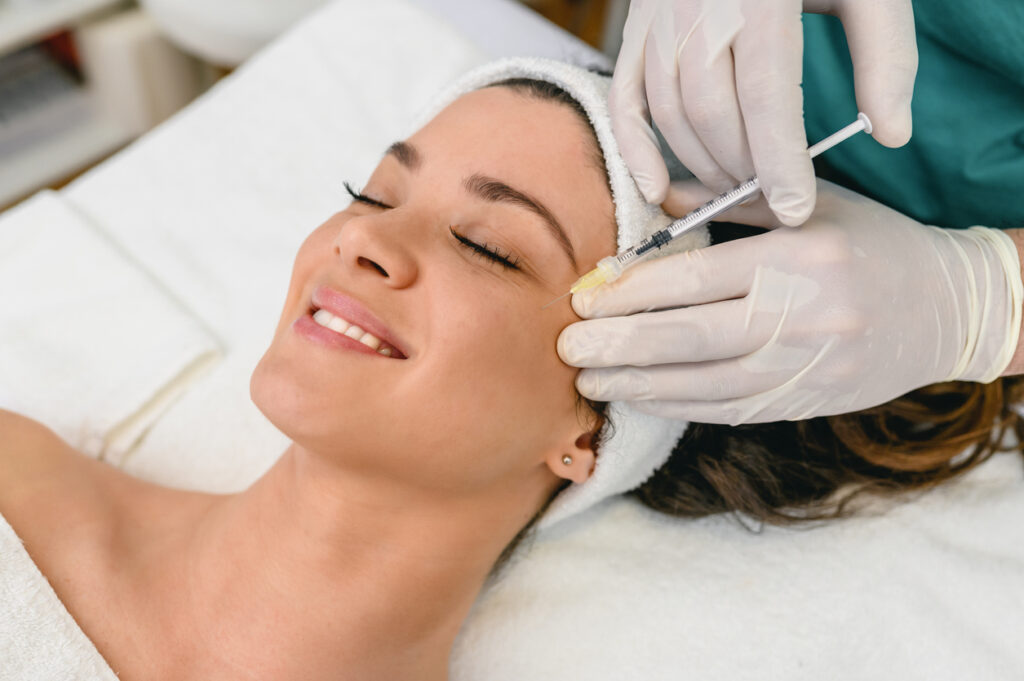 Woman smiling and getting Botox in Jacksonville, FL
